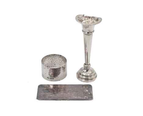 50 gram silver Indian note; silver napkin ring, 33 grams; and a silver posy vase with weighted base.