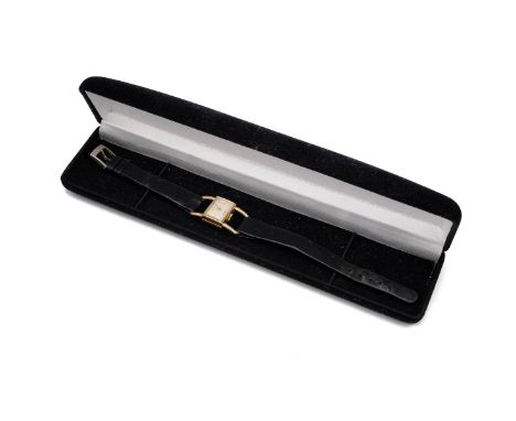 18ct gold Ebel wristwatch. Manual wind, 13mm x 8mm, cream tone dial, black leather strap, gross weight 13.5 grams, approximat