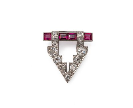 18ct white gold (tested) diamond and ruby clip, of arrow head form. Set with four rubies and 15 graduating diamonds, weight 5