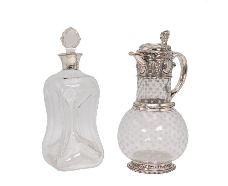 Silver and glass claret jug, the bulbous body and neck decorated with etched stars. With a silver stepped base, handle and to