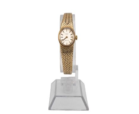 A Rotary 9ct gold ladies wristwatch with oval face and baton numerals and a 9ct gold articulated strap, total weight 25 grams
