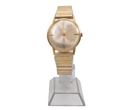 18ct gents wristwatch, Invicta 21. 29mm 18ct gold case, manual wind, silvered dial, baton hands and indices, gold plated expa