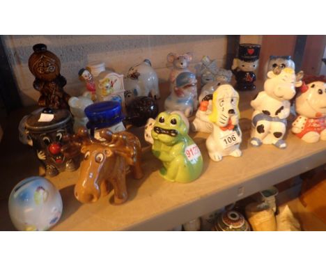 Shelf of approximately twenty five assorted money boxes, mostly ceramic including pigs, dogs, frogs etc