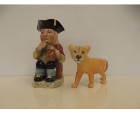 Beswick figure of lion together with a Beswick Toby jug