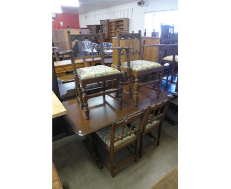 An Ercol dark elm refectory table and six chairs 