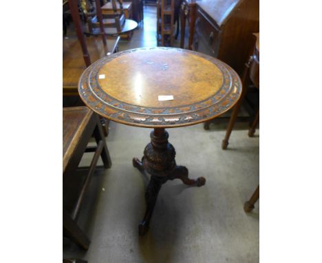 A Victorian walnut and burr walnut circular tripod wine table 