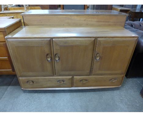 An Ercol Blonde elm and beech sideboard 