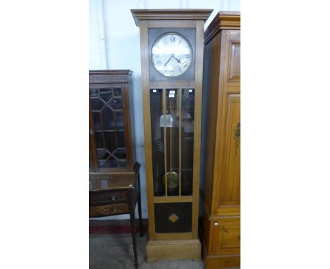 An early 20th Century oak triple weight longcase clock, bearing inlaid G.W.R. letteringn to case 