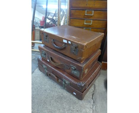 Three vintage leather suitcases 