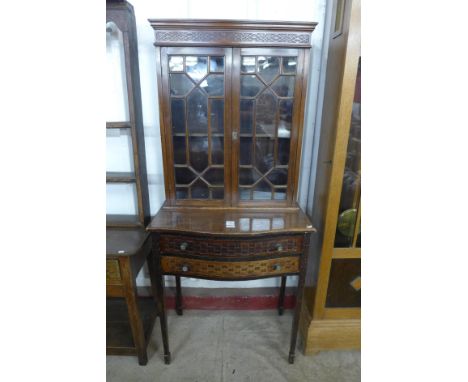 An Edward VII Chippendale Revival mahogany side cabinet, with carved blind fret decoration 