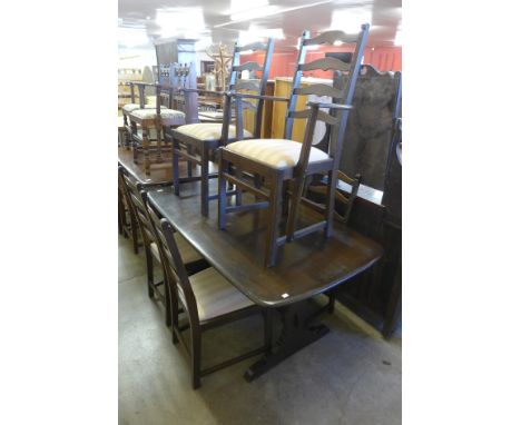 An Ercol dark elm refectory table and six chairs 