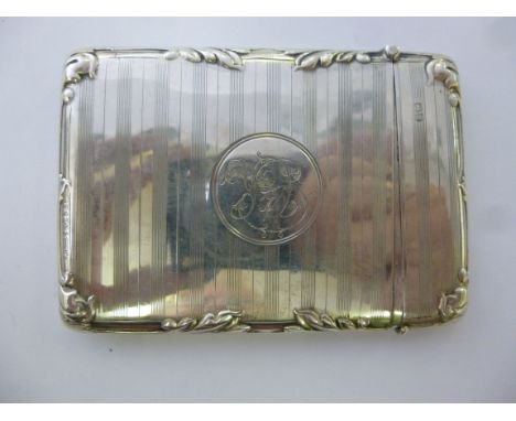 A silver card case, having a hinged cap, decorated with engine turned and foliate cast designs  J&S  Chester 1911       11