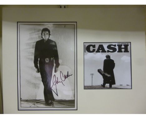 Johnny Cash's autograph, on a monochrome photographic studio portrait, presented in a card mount       T08