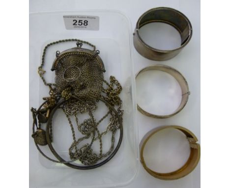 Silver and white metal jewellery: to include a silver bangle with floral engraved ornament  indistinct marks         11