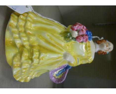 A Royal Worcester china figure 'June'  wearing a yellow dress  No.2096, modelled by Sybil V Williams and Jessamine S Bray  4.