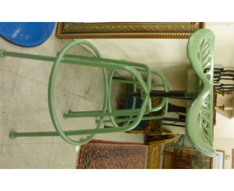 A modern green painted cast iron and steel height adjustable tractor style bar stool, raised on tubular legs         SR