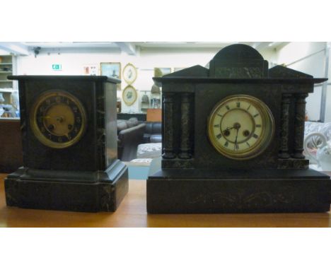 A late Victorian black and green marble cased mantel clock of architectural form; the 8 day gong strike movement faced by a c