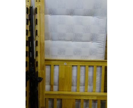 Light wood bed frame with a Sleepmaster Orthostar 4ft mattress