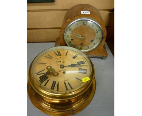 Sestrel brass ship's clock with key and a wooden dome mantel clock with presentation plaque