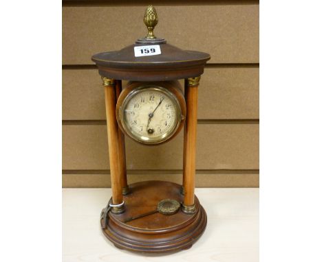 Pendulum mantel clock on pillared supports with drum cased movement