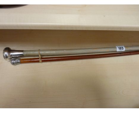 Silver topped swagger stick and a silver topped walking cane