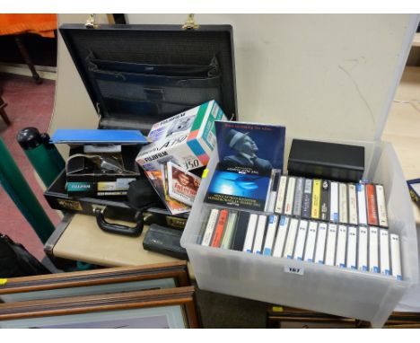 Vintage briefcase, selection of cassettes and CDs and a boxed Fuji 10.2 megapixels camera and other cameras