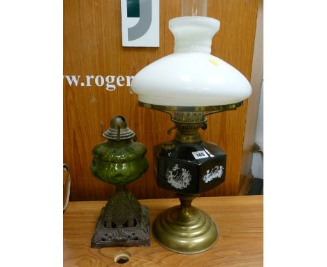 Brass based oil lamp with applied cameo reservoir and another iron based oil lamp