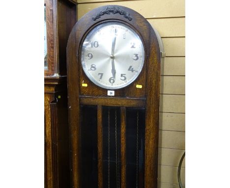 Oak cased dome topped longcase clock with triple weights and pendulum