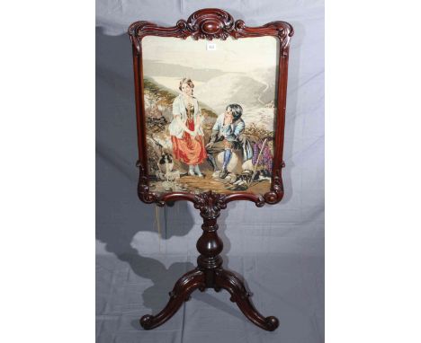 Victorian rosewood glazed needlework panel firescreen on pedestal tripod base, 132cm by 58cm.