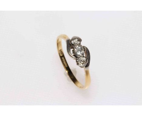 18 carat gold three stone diamond ring.