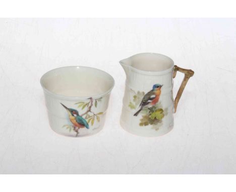 Royal Worcester cream jug and sugar basin, the moulded barrel bodies painted with birds, signed W. Powell.