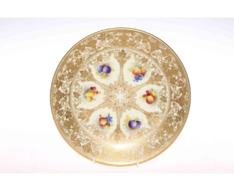 Royal Worcester cabinet plate, having six panels of fruit painted and signed by A. Shuck on ornate gilt over ivory ground, 23