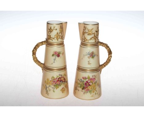 Pair Royal Worcester jugs, printed and painted with flowers on blush ground, gilt handles and foliate moulding, shape no. 104