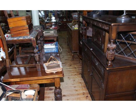 Oak six piece dining suite comprising court cupboard, rectangular draw leaf table and four ladder back chairs.