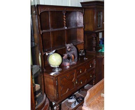 1920's Jacobean style oak shelf back dresser.