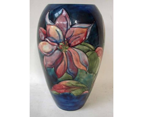 A large William Moorcroft pottery vase, ovoid form, tubeline decorated in a clematis version on green/blue ground ,impressed 