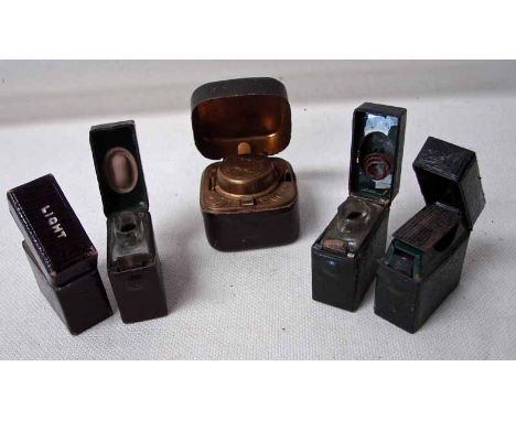 Two sets of travelling ink and vesta cases, leather bound, each engraved 'INK' or 'LIGHT', 4.5cm by 4.5cm together with a squ