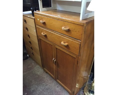 A LIGHT OAK TALLBOY
