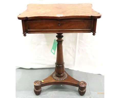 A Regency flame mahogany and walnut single drawer lamp table with tapered pedestal raised on a tripartite base, 53 x 39 x 72 