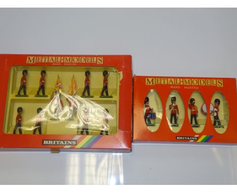 A PAIR OF BRITAINS METAL MODELS SOLDIER SETS to include 7210 SCOTS GUARDS DRUM and BUGLE SET and 7207 SCOTS GUARDS COLOUR PAR