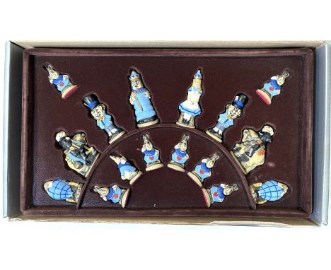 A hand crafted novelty chess set Alice in Wonderland theme in original box with board