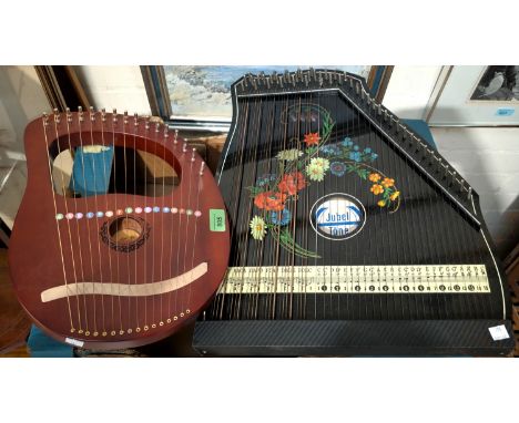 An Aklot 16 string lyre harp; a Jubel Tone zither
