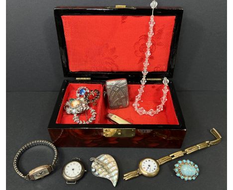 A silver 1920's wrist watch, two gold plated watches, a collection of brooches etc.