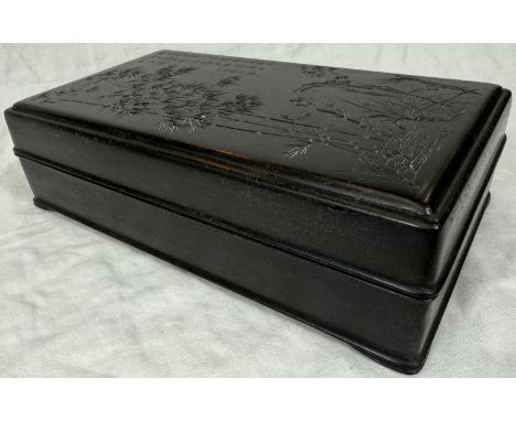 A rectangular Chinese hard wooden box, the top carved with bamboo and Chinese text, similar to Zitan, length 28cm, with conte