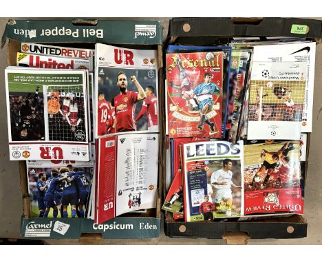 Four boxes of Manchester United programmes running from the 1980's onwards with various cup matches etc