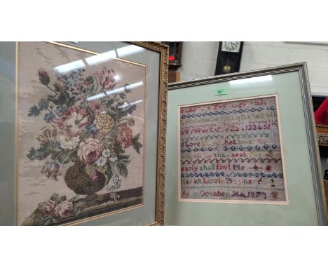 A framed 1879 sampler and another tapestry picture