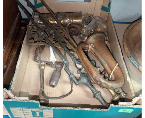 A copper bugle and a selection of brass fire irons etc.