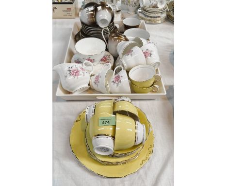 A Colclough yellow and gilt 18-piece part tea service; a 'Duchess' 20-piece part tea service and a continental gilt and brown