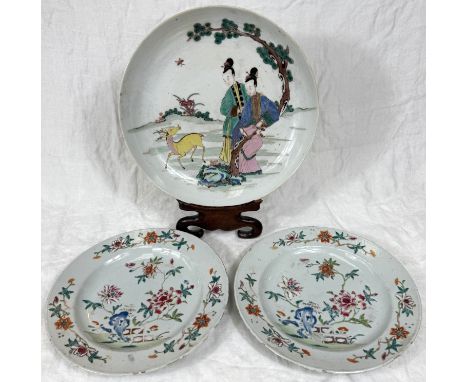 A pair of Chinese plates with polychrome decoration of flowers and branches, diameter 23cm (fritting to edges of each plate);