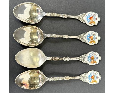 Four Manchester Golf Club hall marked silver trophy spoons with enamel finials, 2.7oz